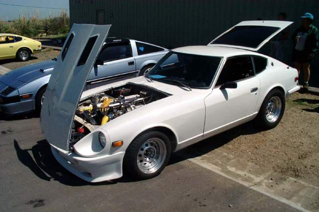 240z with an L28ET swap. custom downpipe, porsche intercooler, xs bov